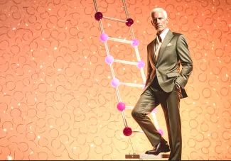 Successful, confident, well-dressed business man on a futuristic ladder.