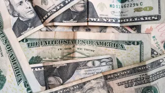 U.S. dollar banknotes by Jorge Salvador courtesy of Unsplash.