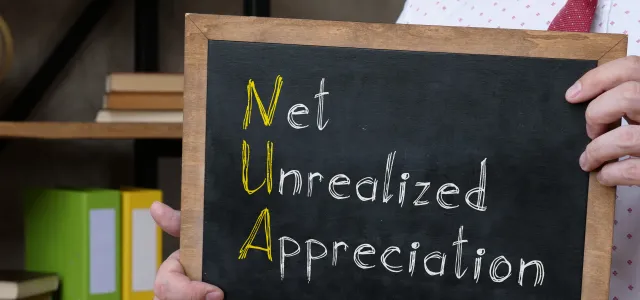Hand-held Chalkboard displaying  Net Unrealized Apprecaition 