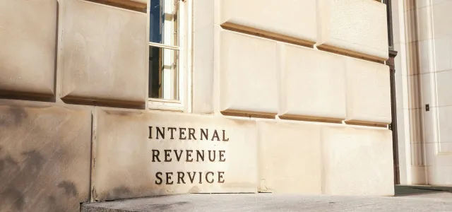 A close up of a building with a sign on it by Sean Lee courtesy of Unsplash.